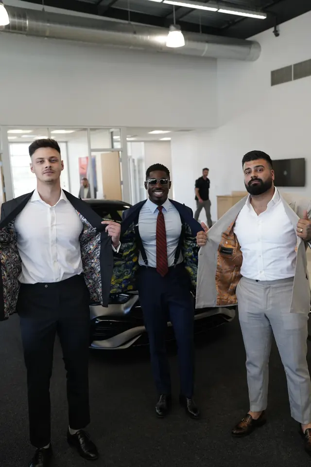 Clients revealing the custom patterned linings inside their bespoke suit jackets